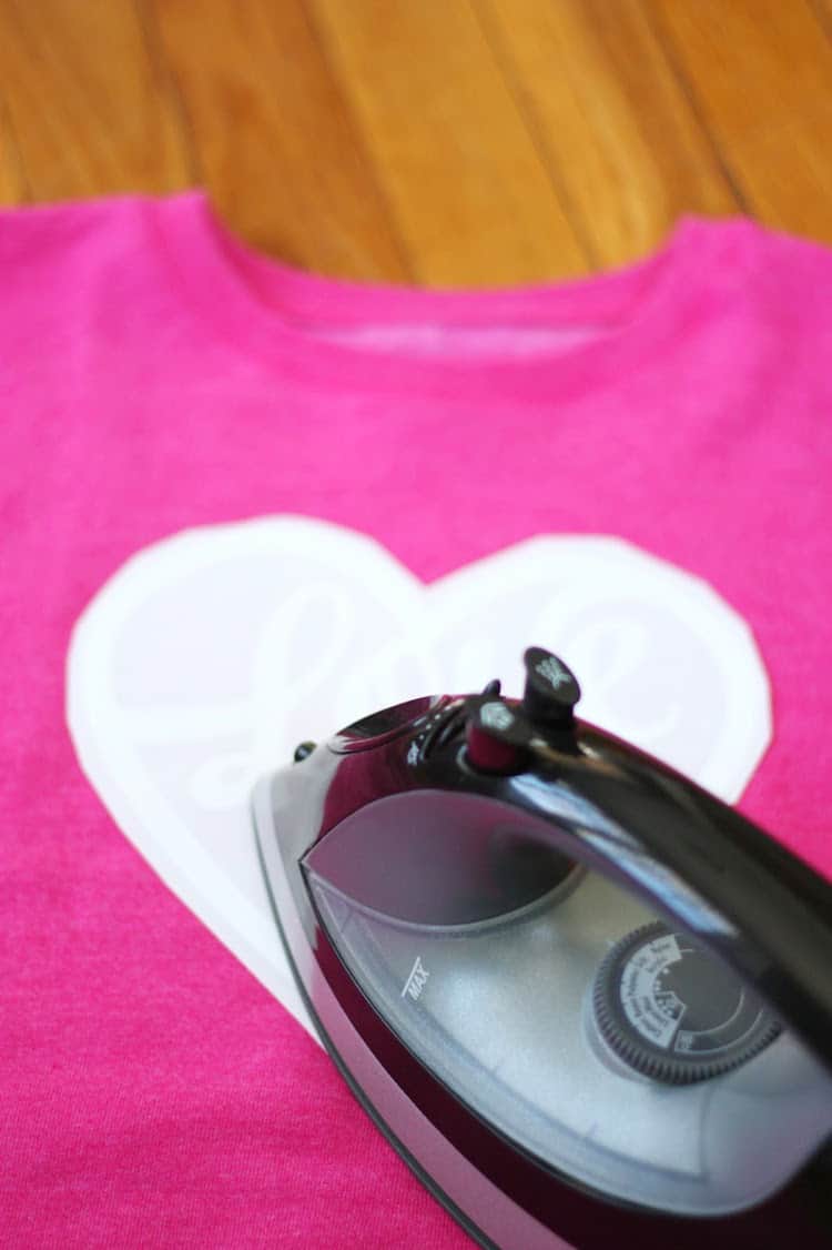 DIY Iron-On Valentine Sweatshirt + featured by Top US Craft Blog + The Pretty Life Girls: + image of valentine sweatshirt being ironed
