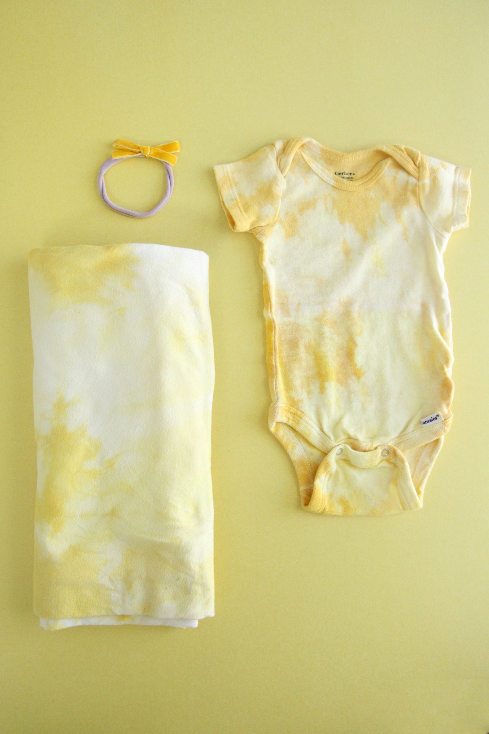 DIY Natural Turmeric Dye Tie Dye Onesies + a tutorial featured by Top US Craft Blog + The Pretty Life Girls