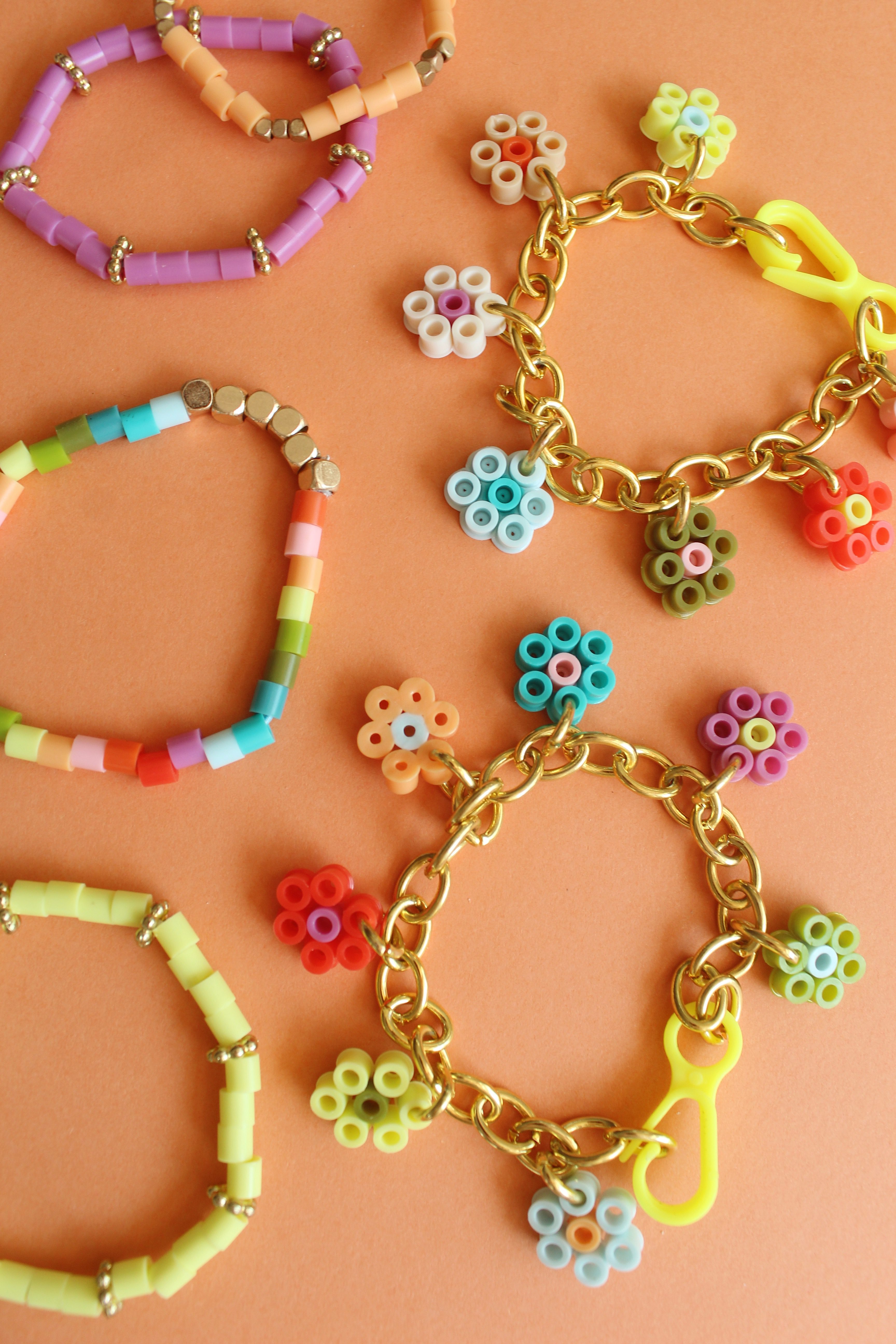 How to Make Flower Charm Perler Bead Bracelets + a tutorial featured by Top US Craft Blog + The Pretty Life Girls